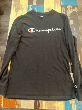 Champion Black Long Sleeve Shirt with Script Logo and Red Accent